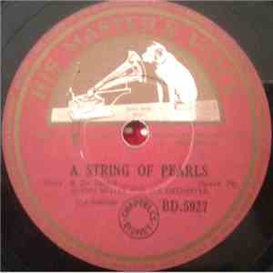 Glenn Miller And His Orchestra - A String Of Pearls / Blue Rain download flac