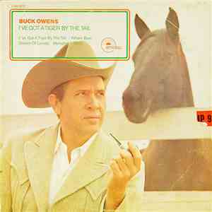 Buck Owens - I've Got A Tiger By The Tail download flac